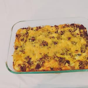 Photograph of Strata - an egg and sausage casserole with cheddar cheese