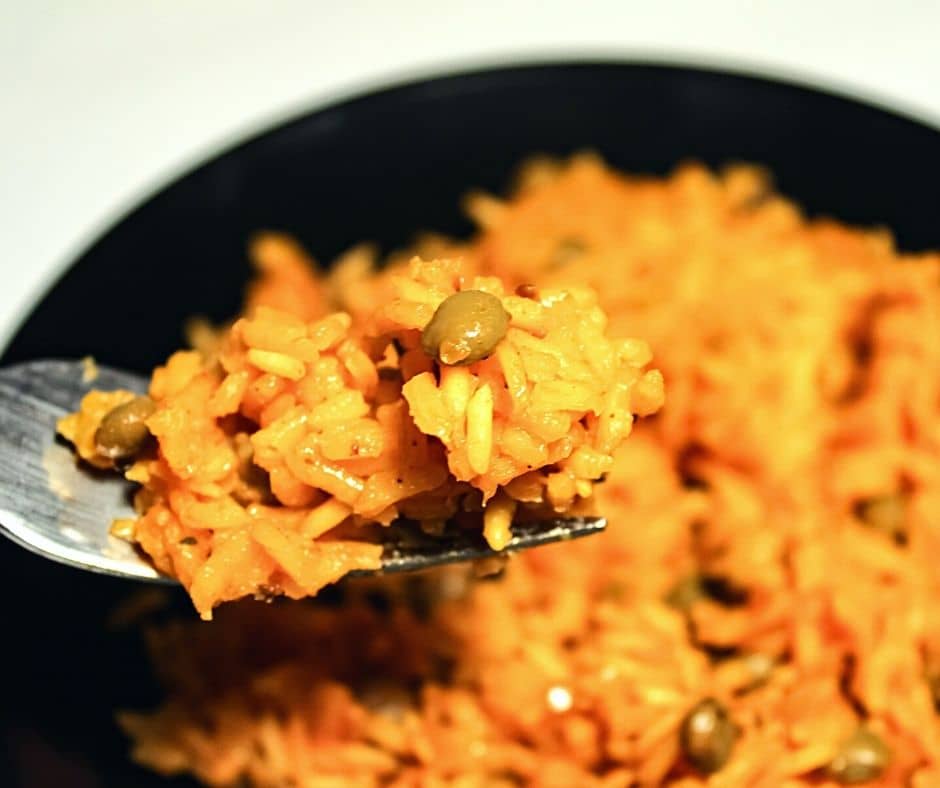 Photograph of Puerto Rico Rice and Pigeon Peas or arroz con gandules, an easy side dish that is versatile, anything goes, throw together. 